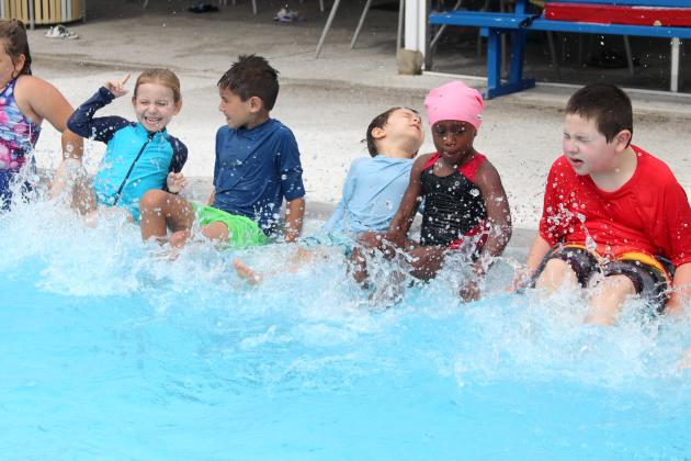 TRISHA MURPHY/Palatka Daily News. During the Learn to Swim swimming lessons on Tuesday at the Putnam Aquatic Center in Palatka, level 1 students practice their kicks. From left are Ella Benson, Brodie Brinkley, Bruce Dodge, Madison Humphrey and Holden Leriner.