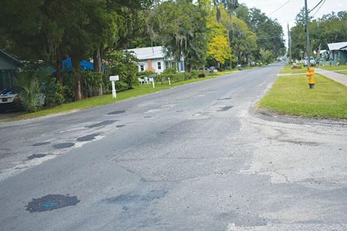 BRANDON D. OLIVER/Palatka Daily News – St. Johns Avenue at the intersection of Bates Avenue can be seen with numerous potholes that have been patched.
