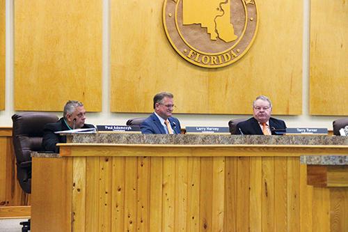 SARAH CAVACINI/Palatka Daily News -- From left, County Commissioners Paul Adamczyk, Larry Harvey and Terry Turner talk about the addition of three positions spread over two departments.