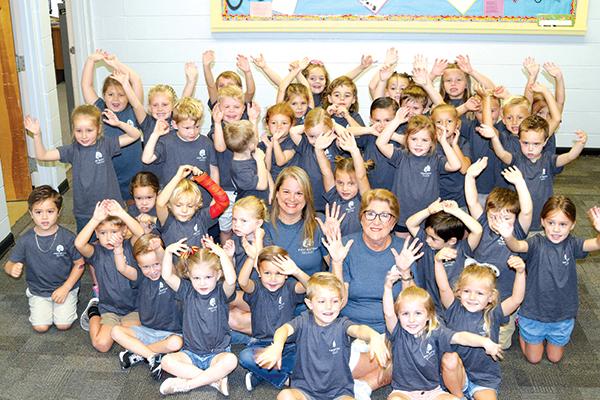 TRISHA MURPHY/Palatka Daily News – First Baptist Preschool students and employees cheer in celebration of the church school’s 75th anniversary.