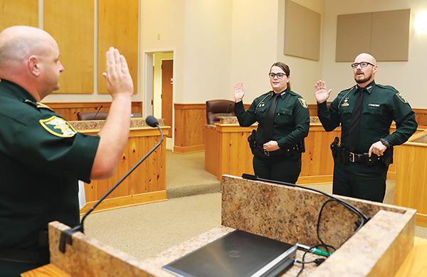 Photo courtesy of the Putnam County Sheriff’s Office Putnam County Sheriff’s Office Deputy Karly Yoder, center, gets sworn in as she is promoted to lieutenant in 2018.