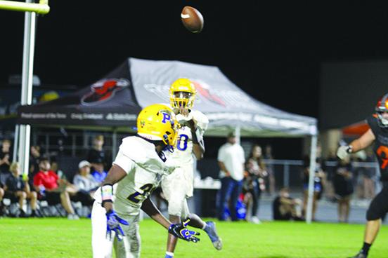 Palatka quarterback Tommy Offord swings a pass out to receiver K.J. Wright during the first half of Friday night’s game at Tocoi Creek. (MARK BLUMENTHAL / Palatka Daily News)