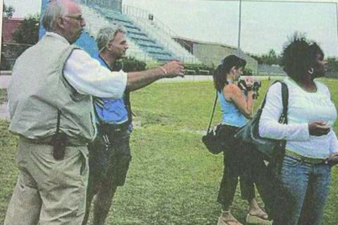 Interlachen High School’s athletic director then, Doug Feltner (left), points out something on the football field at Interlachen High School on April 14, 2005, to “Bound For Glory” director Tiffany Rice (second, right) and producer Nisa Ahmad as the pair were looking at the school as a potential candidate for the ESPN show that fall. Second from left is then-Interlachen head football coach Bobby Humphries. (MARK BLUMENTHAL / Palatka Daily News)
