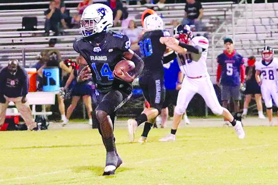Interlachen’s Kemontae Nixon looks for running room during the Rams’ 20-12 win over Pierson Taylor last week. (RITA FULLERTON / Special to the Daily News)