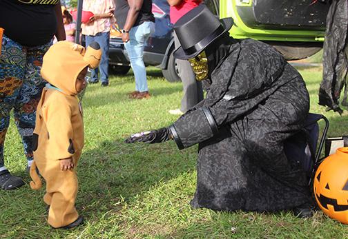 File photo. Jovani Garcia, 10, hands out candy in 2022 at the annual "Trunk or Treat" event in Palatka dressed as a skeleton.