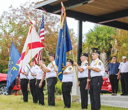 File photo – Veterans from American Legion Bert Hodge Post 45 and VFW Post 3349 hold flags during the 2021 Veterans Day ceremony at the Palatka riverfront.