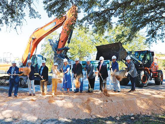 Photo courtesy of the Putnam County School District – Officials from the Putnam County School District and the city of Palatka turn over dirt during a groundbreaking ceremony at the site of the former E.H. Miller School in Palatka.