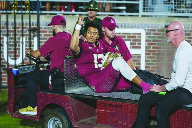 Florida State quarterback Jordan Travis acknowledges the crowd at Doak Campbell Stadium after getting seriously hurt last Saturday against North Alabama. (GREG OYSTER / Special to the Daily News)