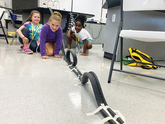 File photo – Putnam County School District students test out the mini rollercoaster they built during a STEM camp in 2022.