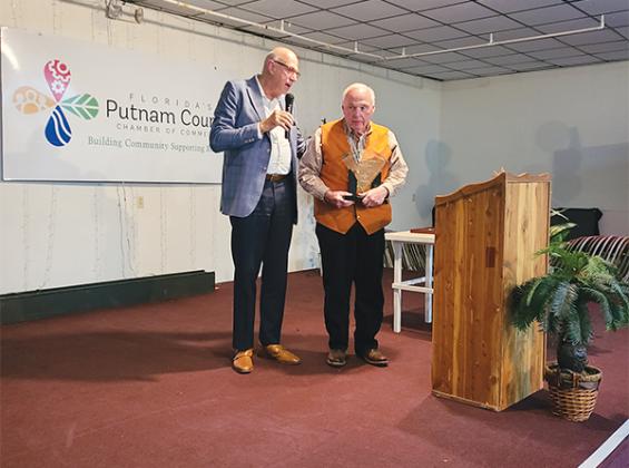 Photo submitted by Dana Jones – Robert Mills, left, presents Wayne McClain with the Wes Larson Living Legacy Award during a Putnam County Chamber of Commerce event last week.