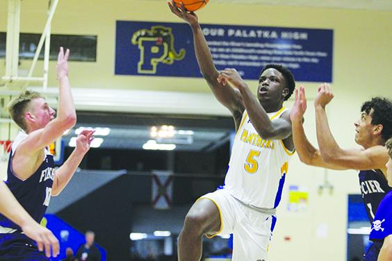 Palatka’s Trenton Williams takes a shot against Neptune Beach Fletcher during last month’s Jarvis Williams Holiday Classic. (MARK BLUMENTHAL / Palatka Daily News)