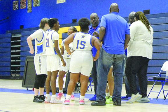 Palatka Junior-Senior High School girls basketball coach Craig Washington gives directions to his players during a second-half timeout Wednesday night as his team won, 46-16, over Crescent City at the John L Williams Athletic Complex. (MARK BLUMENTHAL / Palatka Daily News)