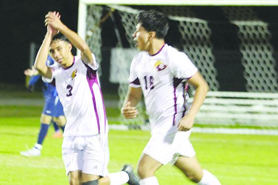 Crescent City's Adrian Pena celebrates scoring a goal in the second half of Thursday night's 1-1 tie with Pierson Taylor. Next to Pena is teammate Bryan Garcia. (MARK BLUMENTHAL / Palatka Daily News)
