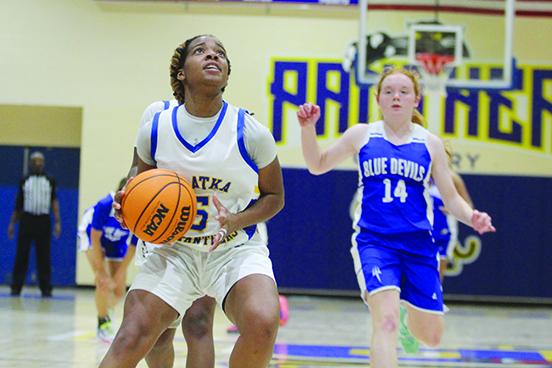 Palatka’s Titianna Peeples goes up for a layup after a steal as Clay’s Kathryn Moran (14) chases after her during the fourth quarter of Wednesday night’s girls basketball game at the John L Williams Athletic Center won by the host Panthers, 50-30. (MARK BLUMENTHAL / Palatka Daily News)