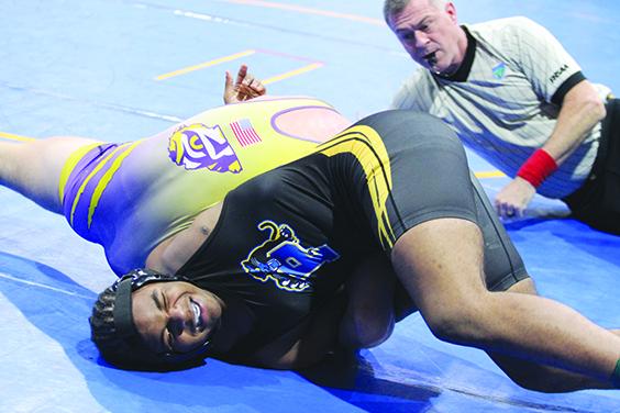Palatka's Dalvan Dallas grimaces as he is put in an arm hold by Union County's Alexander Cortese in the District 4-1A 190-pound title. (MARK BLUMENTHAL / Palatka Daily News)