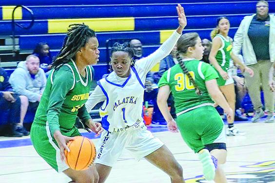 Palatka’s J’hane Fountain (1) looks to block the route of Live Oak Suwannee’s Shadavia Jones during Wednesday night’s District 5-4A tournament semifinal matchup. (RITA FULLERTON / Special to the Daily News)