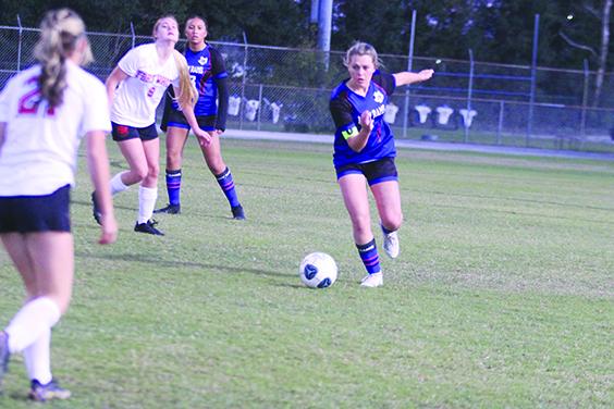 Interlachen’s Madisyn Guessford moves the ball up the field during a November game against Fort White. (MARK BLUMENTHAL / Palatka Daily News)