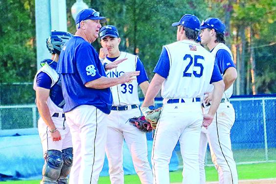St. Johns River State College baseball coach Ross Jones (left) talks to his team during a pitching change in Tuesday’s matchup with Santa Fe College. (RITA FULLERTON / Special to the Daily News)