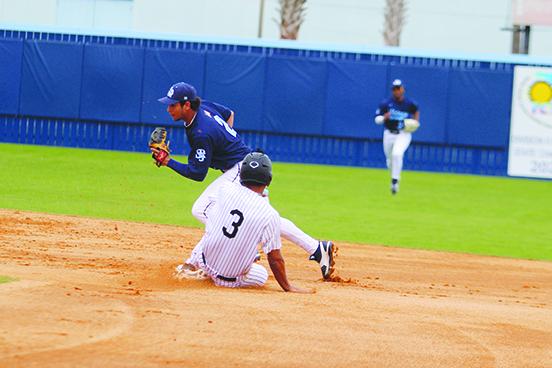 St. Johns River State College second baseman Roger Vergara (2) catches the final out of the fourth inning on a forceout as Miami-Dade’s D’Angelo Ortiz during Saturday’s game at TIndall Field. (MARK BLUMENTHAL / Palatka Daily News)