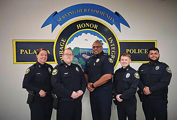 Photo courtesy of Facebook/Palatka Police Department – Former Palatka Police Department Officer Matthew Buchanan, second from right, takes a picture on May 4, 2023, with fellow new officers after they were sworn in by Chief Jason Shaw, center, about a week earlier.