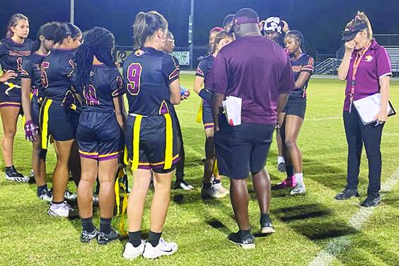 Crescent City Junior-Senior High School flag football players listen to head coach Keenan Henry (back to picture) after losing to Deltona Pine Ridge, 7-6, in the District 11-1A tournament. (COREY DAVIS / Palatka Daily News)