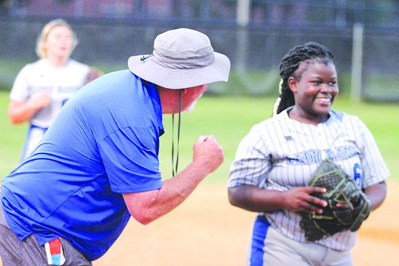 Interlachen softball coach Ron Whitehurst gets a smile out of third baseman Jasmine Smith after the Rams defeated Palatka, 8-2, to win the 2021 Putnam County Tournament title. (MARK BLUMENTHAL / Palatka Daily News)