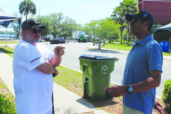 Chad Gay (left), the communications manager for B.A.S.S., talks with Eric Lopez, director of operations for B.A.S.S., on Wednesday, the day before the Bassmaster Elite Tournament begins on the St. Johns River. (MARK BLUMENTHAL / Palatka Daily News)