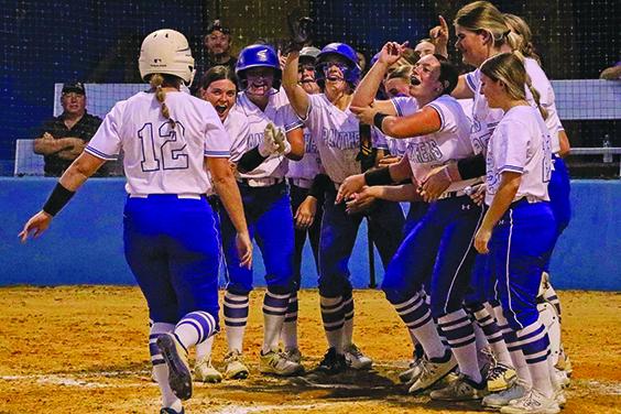 Palatka’s Haleigh Faulkner is greeted at home plate by happy teammates after hitting a three-run, first-inning home run Monday against Interlachen. (RITA FULLERTON / Special to the Daily News)