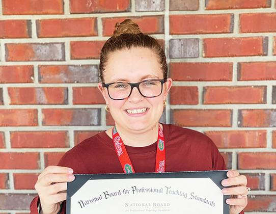 Photo courtesy of Q.I. Roberts Junior-Senior High School – Catelyn Boze, a Q.I. Roberts Junior-Senior High School English teacher who recently won the Robert M. Durling Prize, holds an award she received in 2023.