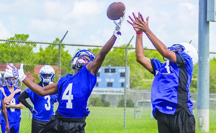 Interlachen’s Thomas Mack (4) goes up to block a pass to William Cruz (23) at the first preseason practice on July 29. Mack caught seven passes and had a 50-yard punt return last Friday. (FRAN RUCHALSKI / Palatka Daily News)