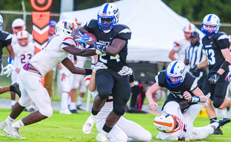 Interlachen’s D.J. Polite runs through a series of arm tackles for 78 yards and a touchdown on the Rams’ first play. (FRAN RUCHALSKI / Palatka Daily News)