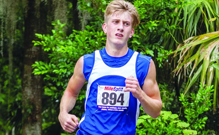 Andrew Dennin comes to the finish line to become the first Peniel Baptist Academy runner, boy or girl, to win an All-Putnam County cross country championship on Wednesday. (FRAN RUCHALSKI / Palatka Daily News)