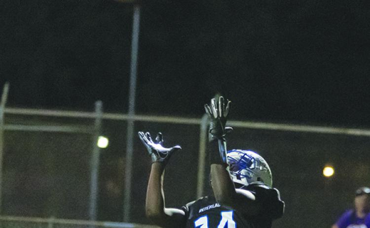 Interlachen's Reggie Allen reaches for a pass last season. He appears to be the leader at quarterback for IHS. (Daily News file photo)