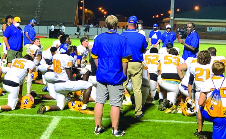 Palatka High School football coach Willie Fells, far right, talks to his players after the Panthers lost to Fleming Island, 29-7, on Friday night. (NICK BLANK / Palatka Daily News)