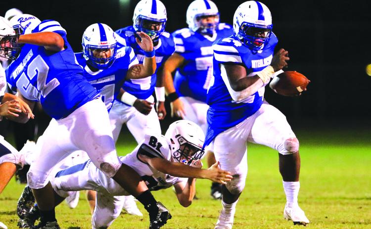 Interlachen’s D.J. Polite busts a tackle attempt by Parrish Community High’s James Keen for yards in the Rams’ win on Sept. 18. (GREG OYSTER / Special To The Daily News)