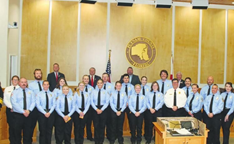 New Putnam County Fire and Emergency Medical Services recruits smile after their pinning ceremony Monday night.