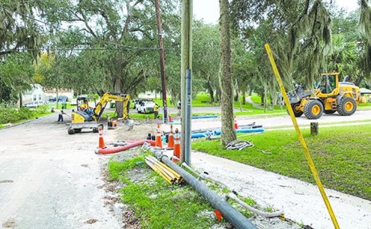 City of Palatka workers carry out infrastructure projects in the area of South 15th Street and Diana Drive on Monday.
