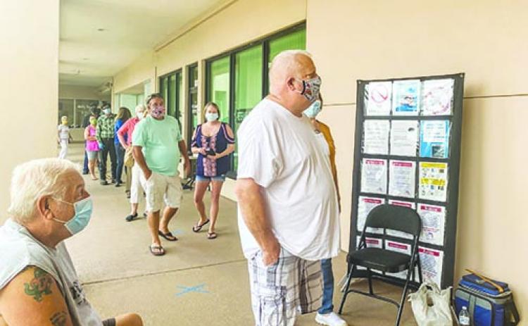 Putnam County residents wait in line Tuesday to cast their vote on the second day of early voting for the 2020 election.