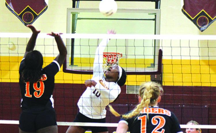 Crescent City’s Aniya Hardy (10) goes up for a kill attempt against Trenton’s Samarie McHenry (19) and Bri Becker during Tuesday’s regional semifinal match. (MARK BLUMENTHAL / Palatka Daily News)