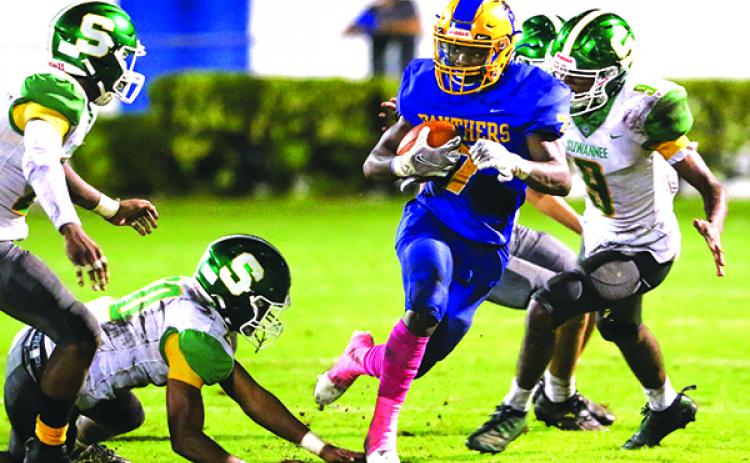 Delton Nealy lugs the ball for yardage during Palatka High’s loss on Oct. 9 to Live Oak Suwannee. The 0-8 Panthers travel to 0-7 Middleburg for a game on Friday night. (GREG OYSTER / Special To The Daily News)
