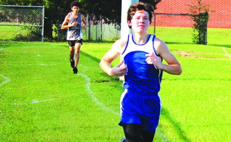 Peniel Baptist Academy’s Caleb Baker, on his way to winning the All-Putnam County cross country championship on Oct. 13, will compete in the state middle school championship in Lakeland. (MARK BLUMENTHAL / Palatka Daily News)