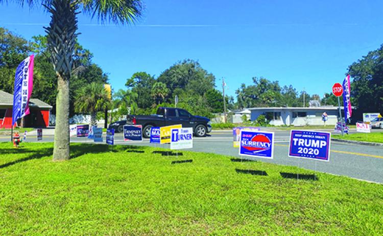 Political signs line the lawn in front of the Elections Office in Palatka on Friday, the day before early voting in Putnam County ends. 