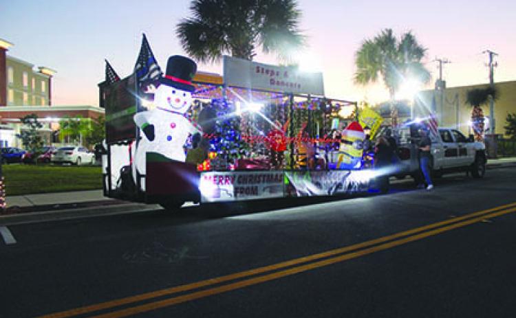 Parade participants prepare a float for last year’s Palatka Christmas Parade.