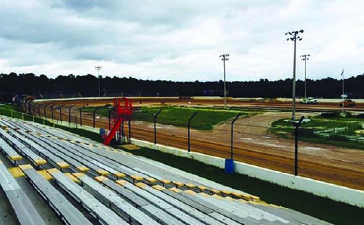 A view from the grandstands as trucks spread new clay recently at the Putnam County Speedway, which is under new ownership.