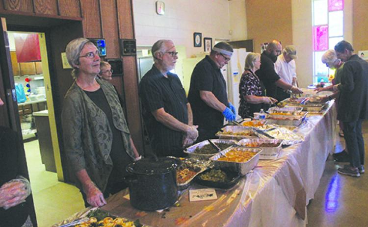 Bread of Life volunteers prepare to serve Thanksgiving last year at the church.