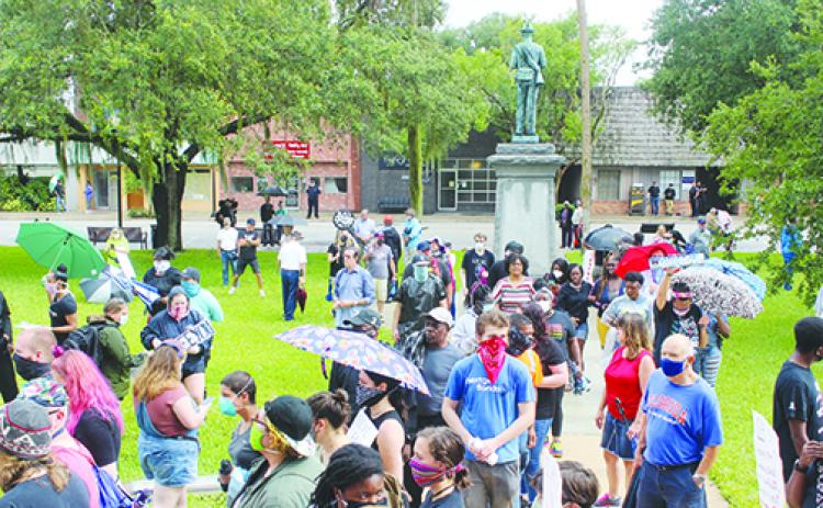 Protesters gather in June in support of relocating the Confederate statue from the Putnam County Courthouse lawn. Another protest is scheduled for Saturday at the courthouse.