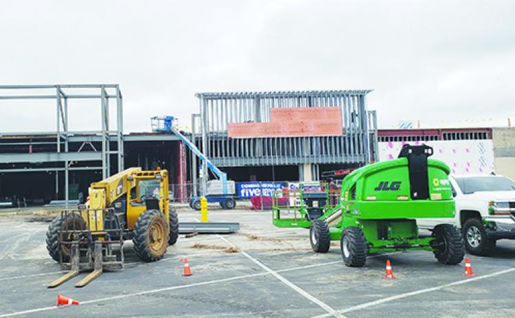 Equipment sits outside the old Kmart building in Palatka as work continues on what will soon become the retail chains Marshalls and Five Below.