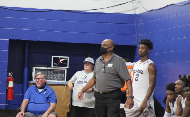 Interlachen head coach C.S. Belton stands next to player Der'Tavious Mack during the Rams' opening game of the season against Middleburg. (MARK BLUMENTHAL / Palatka Daily News)