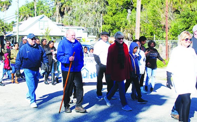 Hundreds of people begin the Martin Luther King Jr. Day parade last year in Palatka. This year’s event has been canceled.
