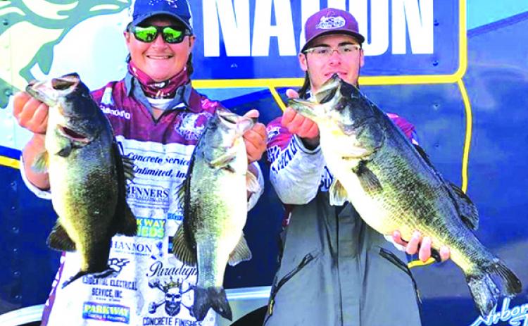 Aaron Yavorsky, left, and Jett Stanley show off their winning catches during the third annual North Regional Junior Bass Tournament for high school students on Sunday at the Palatka docks. (Submitted / GLENN CALE)